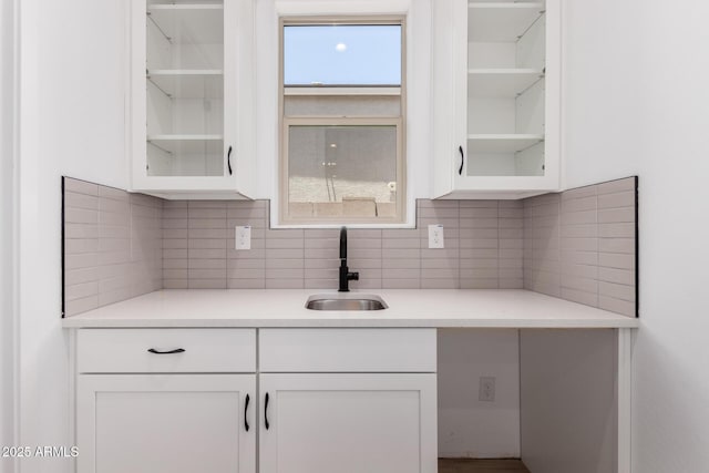 20273 W Monterey Way, Buckeye, AZ 85396 - kitchen with white cabinetry, glass insert cabinets, light countertops, and backsplash