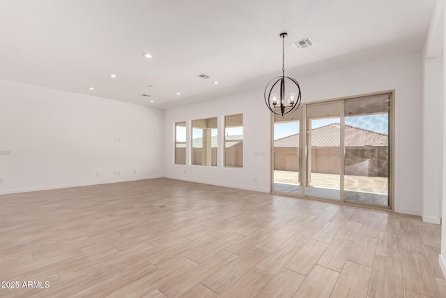 20273 W Monterey Way, Buckeye, AZ 85396 - unfurnished room with a chandelier, light wood-style floors, and recessed lighting