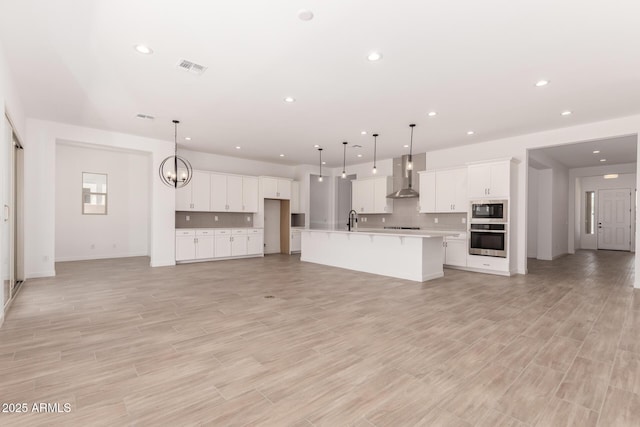 20273 W Monterey Way, Buckeye, AZ 85396 - unfurnished living room featuring recessed lighting and light wood-style flooring