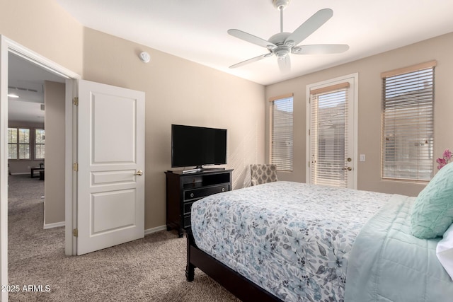 bedroom featuring baseboards, access to outside, a ceiling fan, and light colored carpet