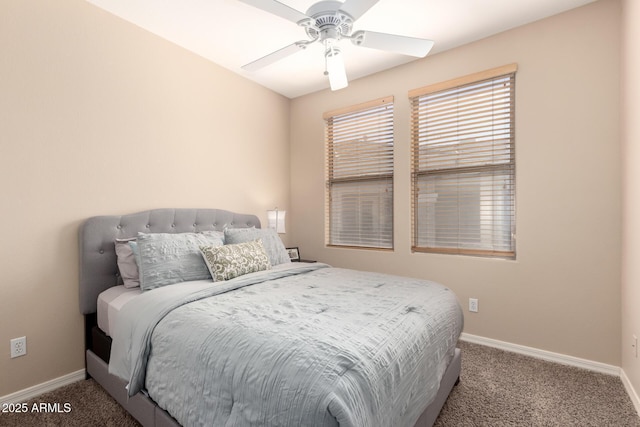 bedroom with a ceiling fan, baseboards, and carpet flooring