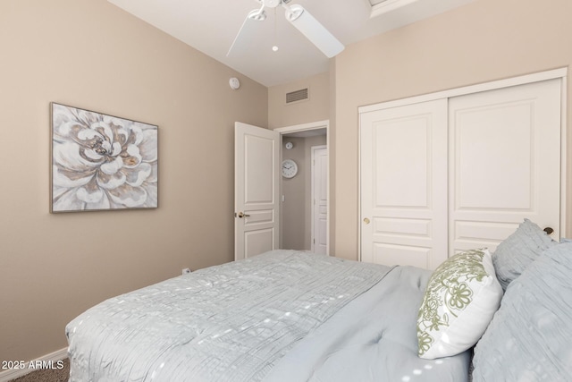 bedroom featuring baseboards, ceiling fan, visible vents, and a closet