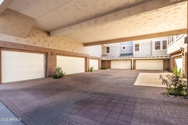 garage featuring wallpapered walls