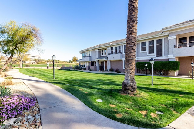 view of community featuring a yard