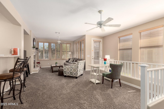 interior space with visible vents, baseboards, and ceiling fan