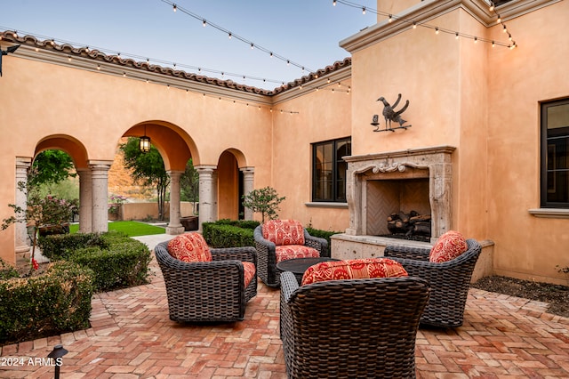 view of patio featuring an outdoor fireplace