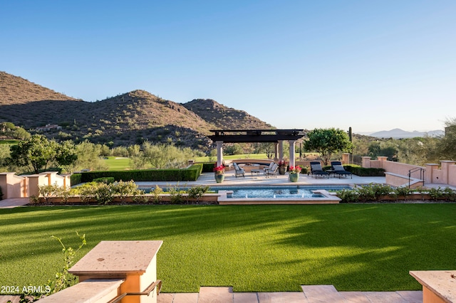 view of yard with a pergola, a patio area, and a mountain view