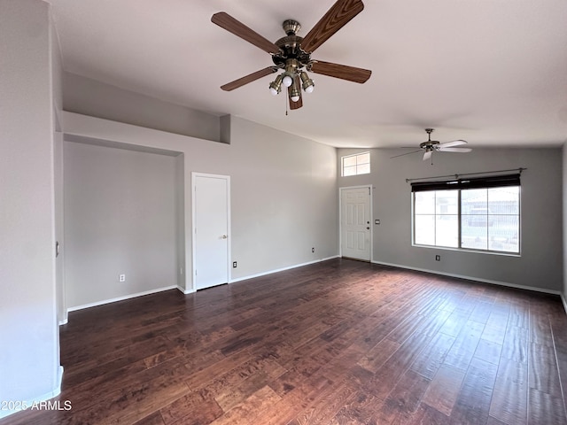 unfurnished room featuring dark wood-type flooring and ceiling fan