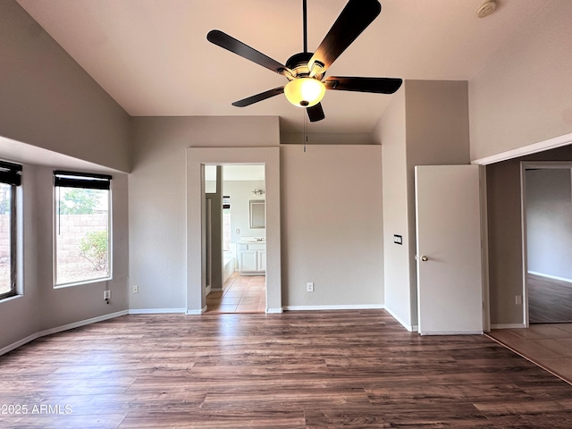 interior space with ceiling fan and wood-type flooring