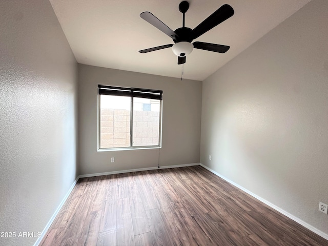 unfurnished room with ceiling fan and hardwood / wood-style flooring