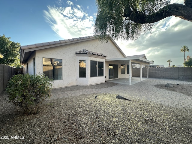 back of property with a patio area