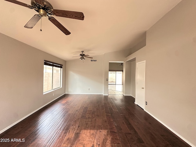 unfurnished room featuring ceiling fan, dark hardwood / wood-style flooring, and lofted ceiling