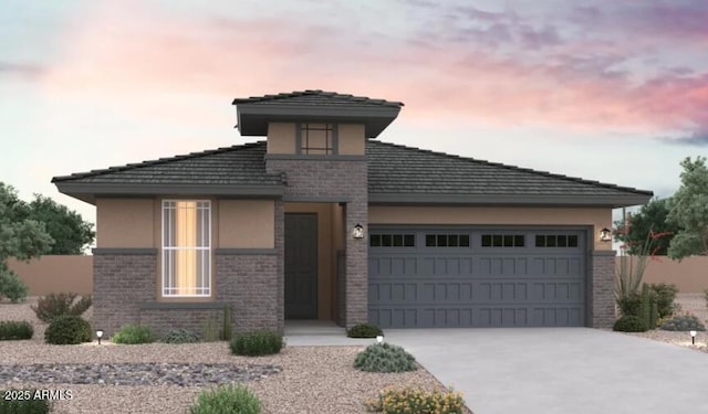 31982 N 117th Ave, Peoria, AZ 85383 - prairie-style house featuring stucco siding, a garage, driveway, and brick siding