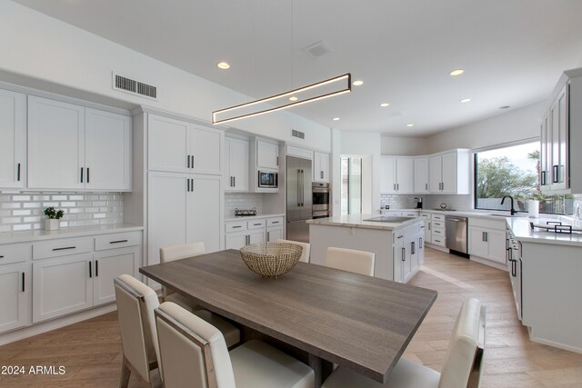 living room featuring light hardwood / wood-style flooring and a tile fireplace