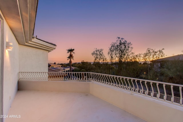 view of balcony at dusk