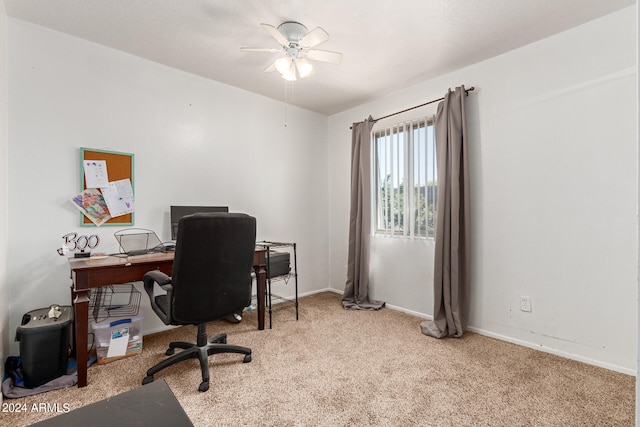 carpeted office with ceiling fan