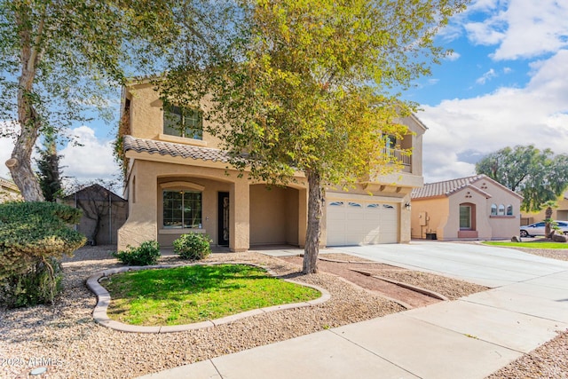 mediterranean / spanish-style home with a garage