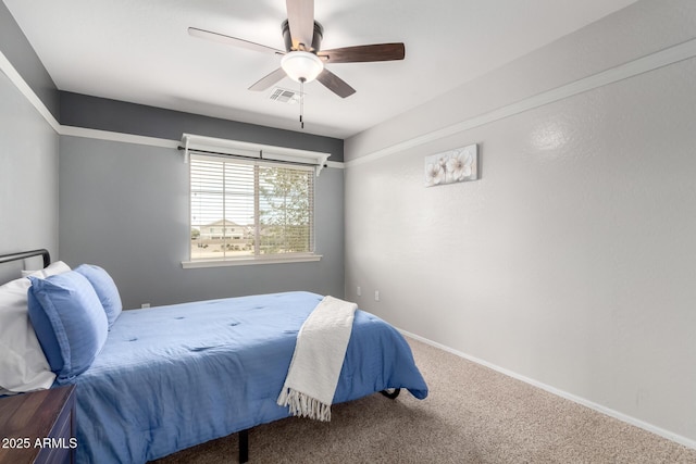 bedroom featuring ceiling fan and carpet