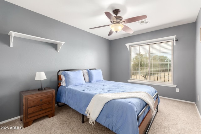 bedroom featuring ceiling fan and light carpet