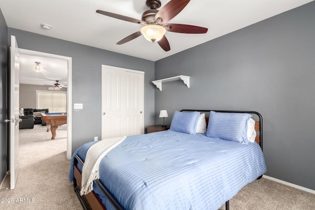 bedroom with pool table, light carpet, ceiling fan, and a closet