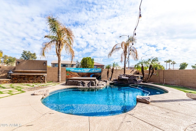 view of swimming pool featuring a patio and pool water feature