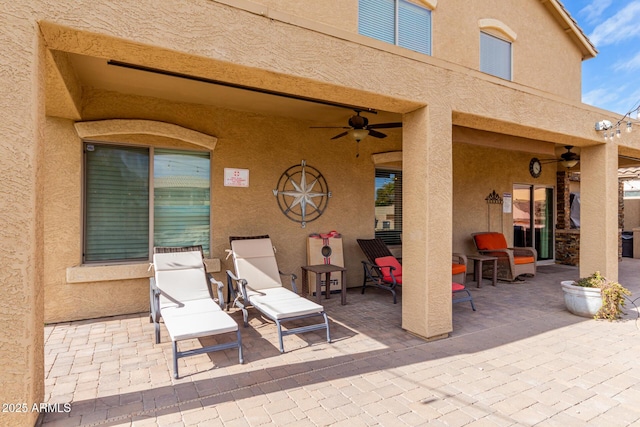 view of patio / terrace featuring ceiling fan