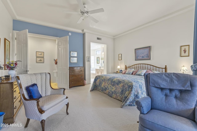 bedroom with visible vents, ornamental molding, a ceiling fan, carpet flooring, and ensuite bath