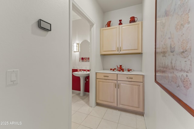 kitchen featuring light countertops, light brown cabinets, and light tile patterned floors