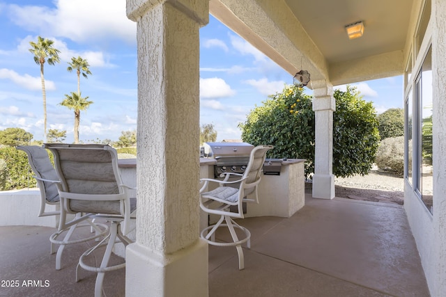 view of patio / terrace featuring outdoor wet bar