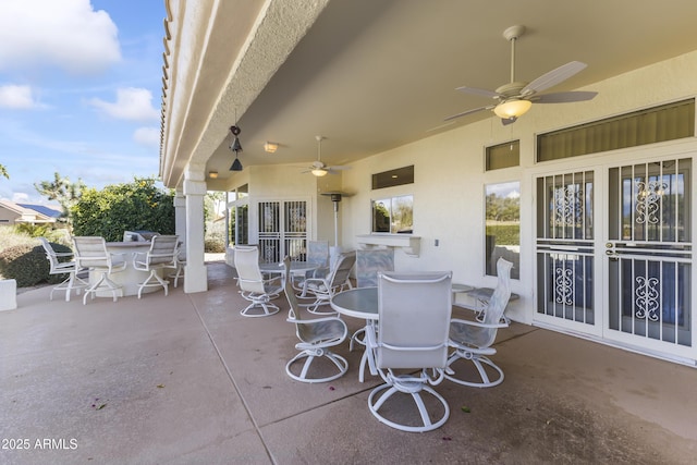 view of patio / terrace featuring outdoor dining area and a ceiling fan