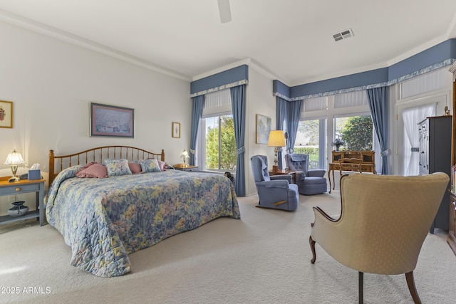 bedroom featuring a ceiling fan, carpet, visible vents, and ornamental molding