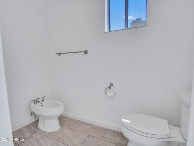 15377 W Catalina Ct, Goodyear, AZ 85395 - half bath featuring a bidet and tile patterned floors