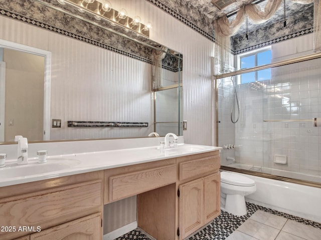 15377 W Catalina Ct, Goodyear, AZ 85395 - bathroom featuring double vanity, combined bath / shower with glass door, and tile patterned flooring