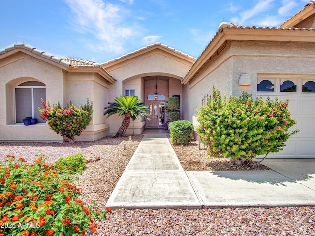 15377 W Catalina Ct, Goodyear, AZ 85395 - entrance to property featuring stucco siding, a tile roof, and a garage