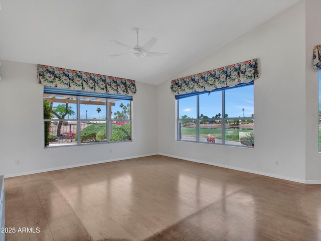 15377 W Catalina Ct, Goodyear, AZ 85395 - spare room featuring wood finished floors, ceiling fan, and high vaulted ceiling