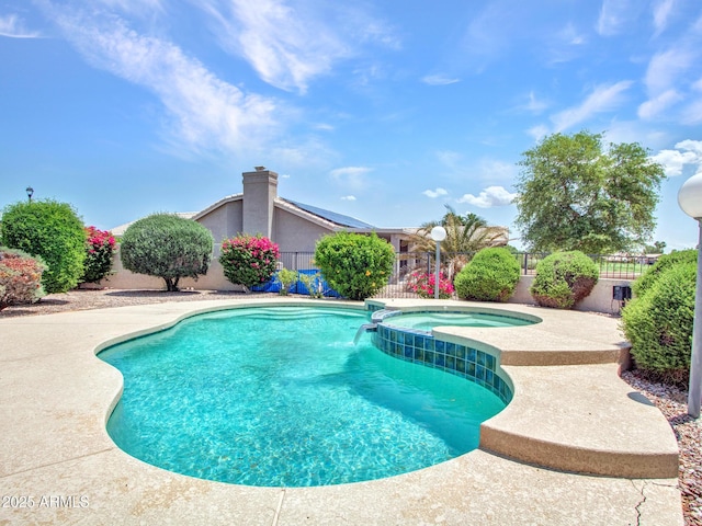 15377 W Catalina Ct, Goodyear, AZ 85395 - view of swimming pool with a fenced backyard, a pool with connected hot tub, and a patio