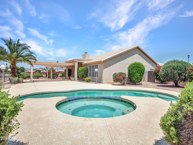 15377 W Catalina Ct, Goodyear, AZ 85395 - view of swimming pool featuring a pool with connected hot tub and a patio area