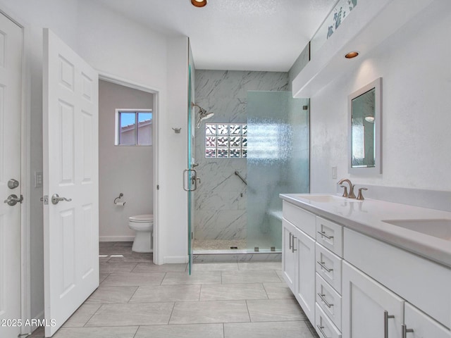 15377 W Catalina Ct, Goodyear, AZ 85395 - bathroom with a marble finish shower and double vanity