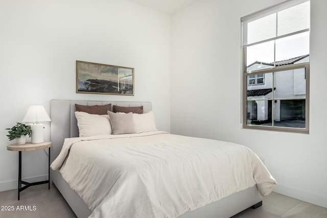 bedroom with light tile patterned floors