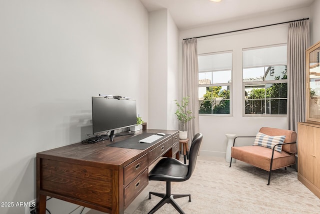 office area featuring light colored carpet