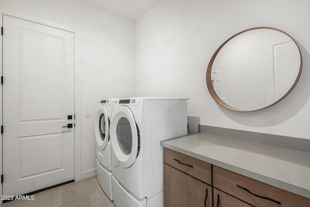 washroom featuring washer and dryer and light tile patterned flooring