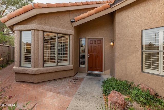 property entrance with a patio