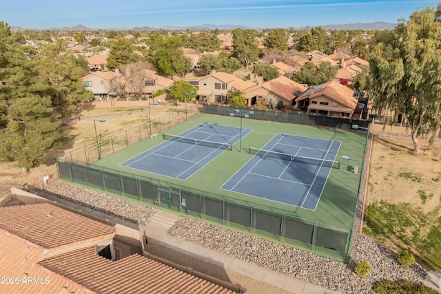 view of sport court with a mountain view