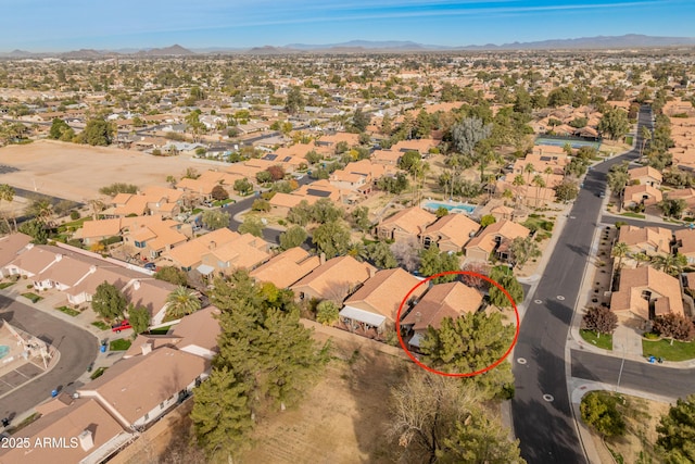 birds eye view of property featuring a mountain view