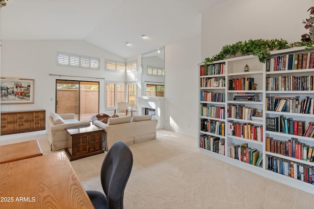 carpeted office featuring vaulted ceiling