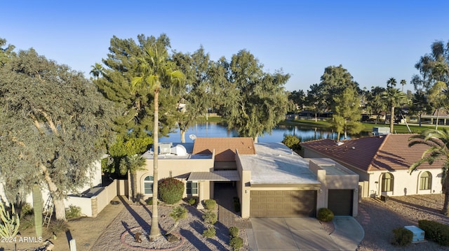 birds eye view of property featuring a water view