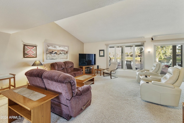 living room featuring carpet flooring and lofted ceiling