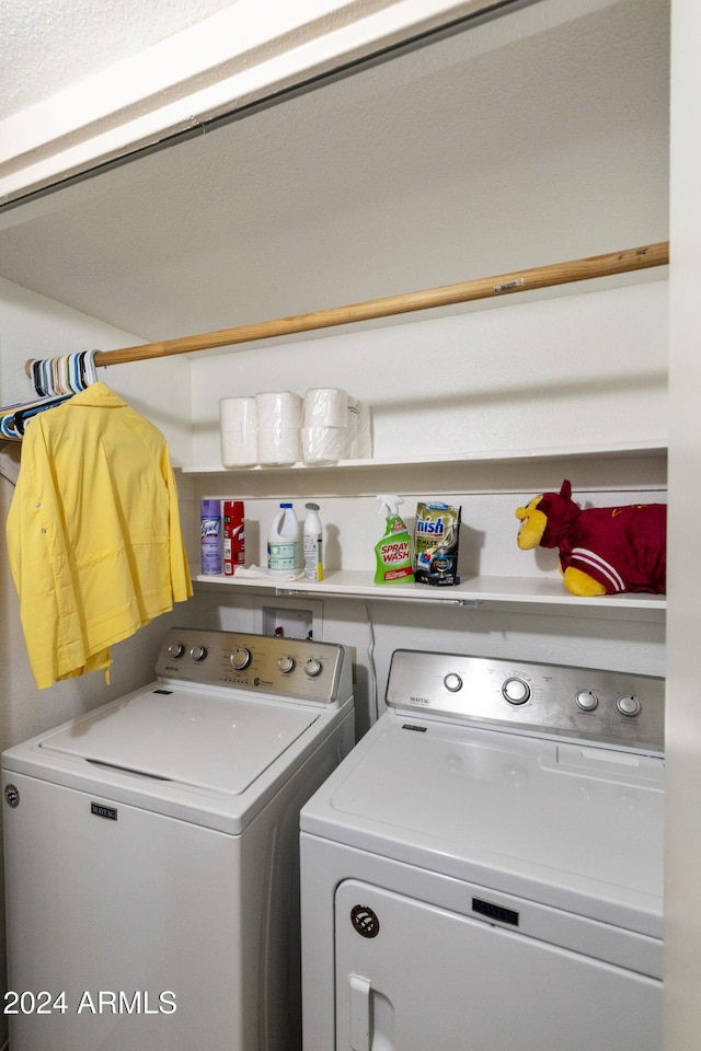 laundry room with independent washer and dryer