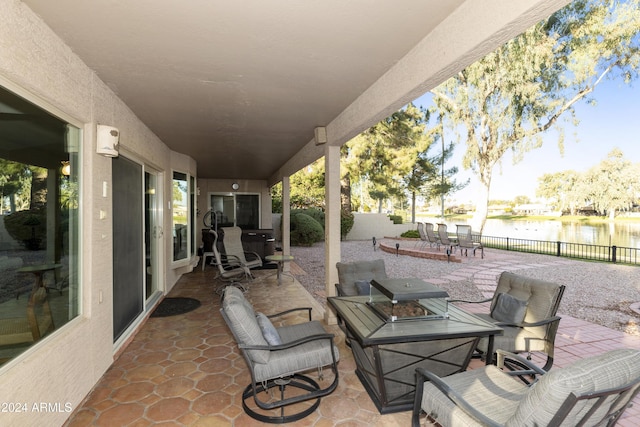 view of patio / terrace with a water view