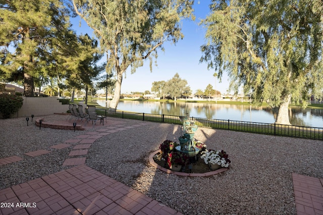 view of yard featuring a patio and a water view